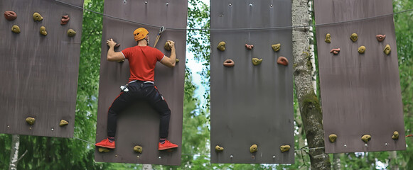 male climber rope park, outdoor activity training, guy, man extreme weekend in the forest