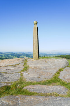 Lord Nelsons monument high on the multi coloured gritstone of Birchen Edge