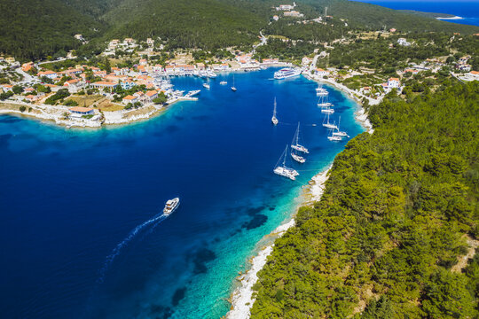Beautiful Fiscardo village at Kefalonia island. Port with yacht boats and a ferry