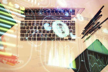Multi exposure of data drawing hologram over topview of study desk background with computer. Concept of technology.