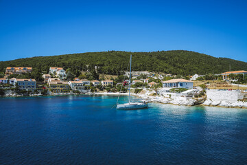 Fototapeta na wymiar Sailing yacht boat moored close to Fiscardo village in Kefalonia island, Greece