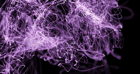 Purple lights trails moving against black background