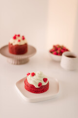 Obraz na płótnie Canvas Raspberry muffins with cream on white background