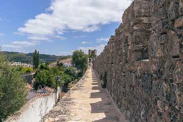 Fototapeta na wymiar Óbidos - June 29, 2021: The medieval town of Óbidos, Portugal