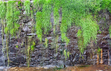 A beautiful waterfall on the natural swimming pool in Arrago river