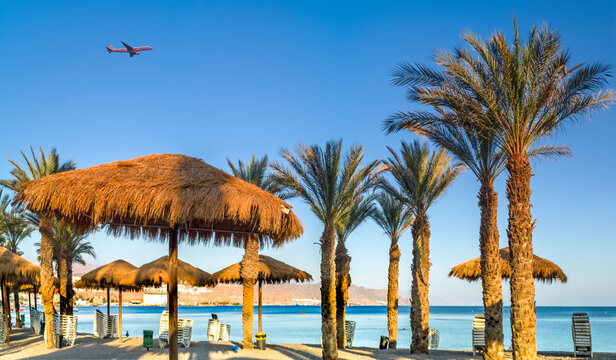 Morning on sandy beach of the Red Sea in Eilat - famous tourist resort city in Israel