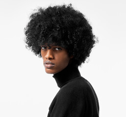 Fototapeta na wymiar Close-up portrait of young handsome black man with stylish afro isolated on white background