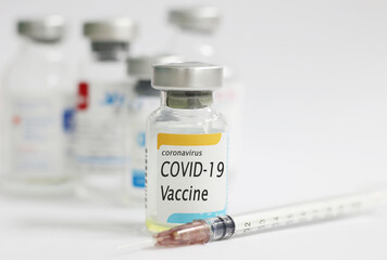 COVID-19 vaccine concept with white background and syringe injection, protective from novel coronavirus 2019.