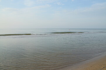 quiet sea.
good weather.
clear sky.
weak waves.