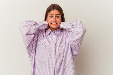 Young caucasian woman isolated on white background feeling confident, with hands behind the head.