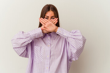 Young caucasian woman isolated on white background points sideways, is trying to choose between two options.