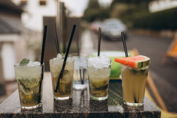 Several summer fresh cocktails are already set for a party.
