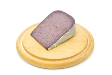 Organic cheese with lavender on a wooden board isolated on a white background.