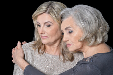 Close up portrait of two sad women posing