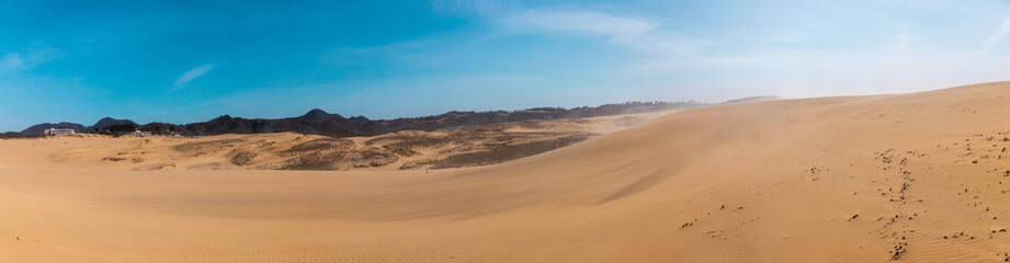 Beautiful Panorama landscape Tottori Sand Dunes (Tottori Sakyu), located near the city of Tottori in Tottori Prefecture, in sunny day. They form the large dune system over 2.4 km in Sanin area, Japan