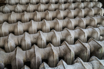 Background of cast iron batteries attached to each other