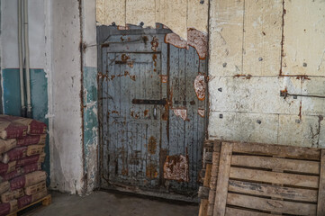 Old authentic wooden door in the workshop