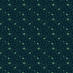 Seamless, hand-drawn nuanced pattern with rings and hearts in green on a dark green background. Textured delicate ornament for textiles, wallpaper, packaging, wrapping paper, wedding decor.