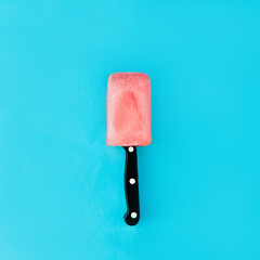 A knife stabbed into the ice cream. Ice cream. Pain in throat. Minimal composition.