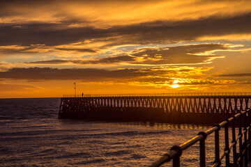 A glorious morning at Blyth beach, with a beautiful sunrise over the old wooden Pier stretching out...