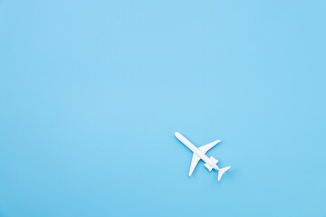 Naklejka na ściany i meble Flat lay of airplane for travel