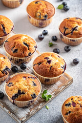 Homemade vegan blueberry muffins on white background.