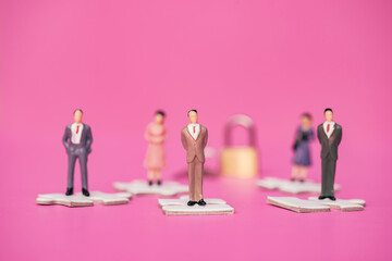 Professional business miniature teamwork. Group of business people leadership with secretary assistant for  unlock project and fix problem on pink background. Investment concept.
