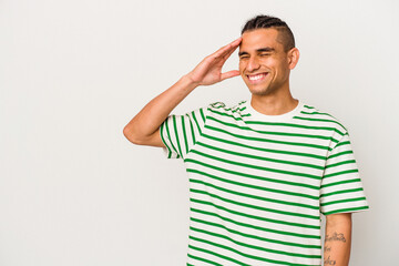 Fototapeta premium Young venezuelan man isolated on white background laughing happy, carefree, natural emotion.