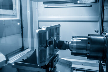 The horizontal CNC milling machine cutting the mold parts. The special type of machining center.