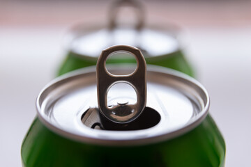 Open beverage can, used, shot against the light, with raised opening lip. Recycling of waste and...