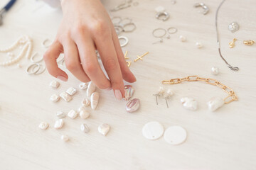 Professional jewelry designer making handmade jewelry in studio workshop. Fashion, creativity and...