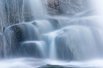 Fototapeta na wymiar Landscape of a cascade at Bond Falls captured with motion blur, Michigan's Upper Peninsula, USA