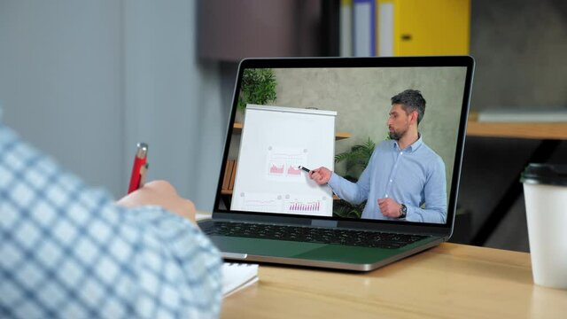 Man at home study watch online business webinar master class course laptop, writes in notebook listen teacher. Distance coach in computer screen point marker diagram on whiteboard teaches student