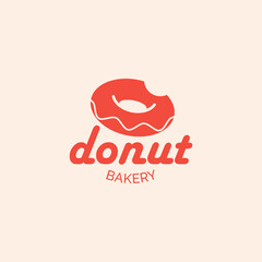 Minimalist logo or emblem for donut shop and bakery. Bright vector design with bitten donut. Identity. Business Card.
