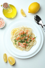 Concept of tasty eating with shrimp pasta on white background