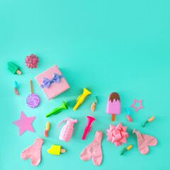 Party confetti and a place for copy space. Celebration, parties. On a turquoise background.