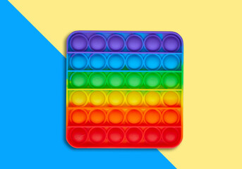 Silicone toy antistress popit. New trend. Colorful anti stress sensory toy fidget push pop it . Flat lay with copyspace.