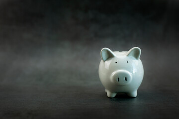 Piggy bank on black background, Business finance saving piggy bank concept, Copy space.