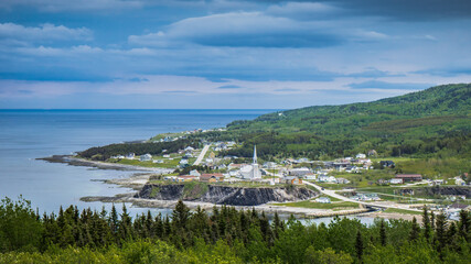 Fototapeta na wymiar View on Grand Vallée small town from the scenic route 132 in Gaspesie (Quebec, Canada)