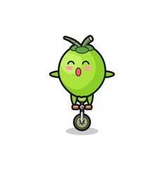 The cute coconut character is riding a circus bike