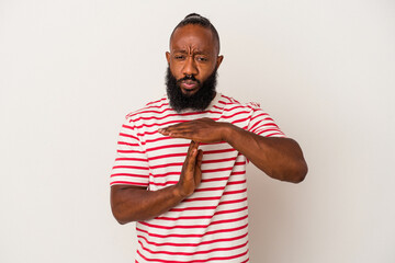 African american man with beard isolated on pink background showing a timeout gesture.