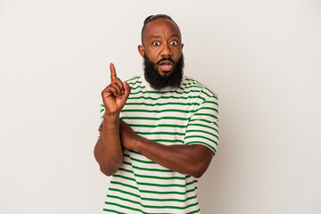 African american man with beard isolated on pink background having some great idea, concept of creativity.