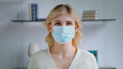Young woman in a medical mask