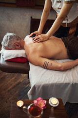 Man getting thai massage after tea ceremony