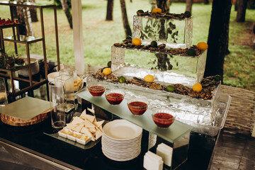 decorated table in a restaurant with oysters and sauces