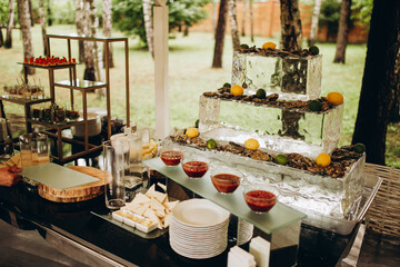 decorated table in a restaurant with oysters and sauces