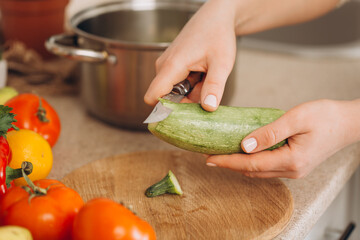 Woman cutting fruits and vegetables