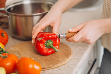 Woman cutting fruits and vegetables