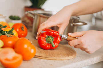 Woman cutting fruits and vegetables