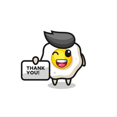 the mascot of the fried egg holding a banner that says thank you